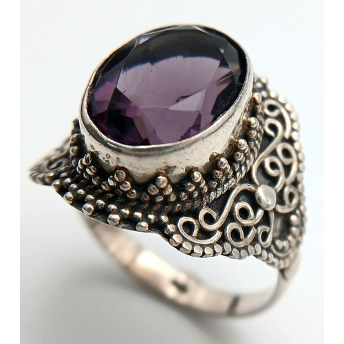 1722 - A Vintage Sterling Silver Amethyst Set Filigree Design Ring Size S. Set with a 1.4cm Length Top Colo... 