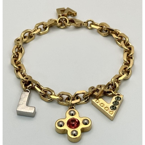 1230 - A Louis Vuitton Gold Plated Bracelet with Hanging Charms. 21cm.