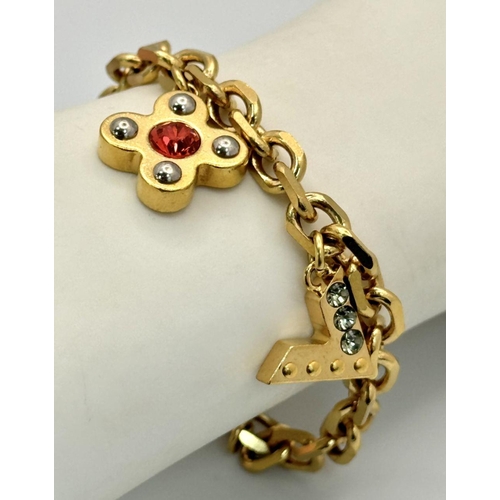 1230 - A Louis Vuitton Gold Plated Bracelet with Hanging Charms. 21cm.