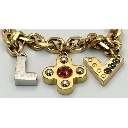 1230 - A Louis Vuitton Gold Plated Bracelet with Hanging Charms. 21cm.