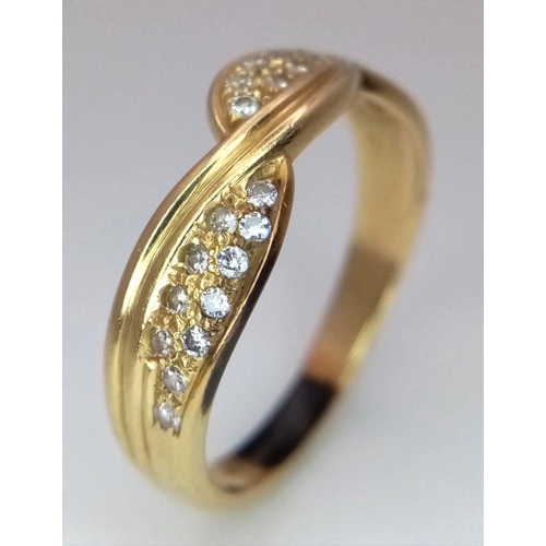 1097 - An 18K Gold Diamond Crossover Ring. 22 small round cut diamonds. Size S. 4.2g total weight. ref: STK... 