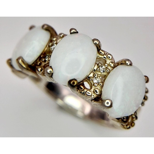 1778 - A Sterling Silver Filigree Design Opal Set Ring Size N. Set with three 8mm Long Opal Cabochons with ... 