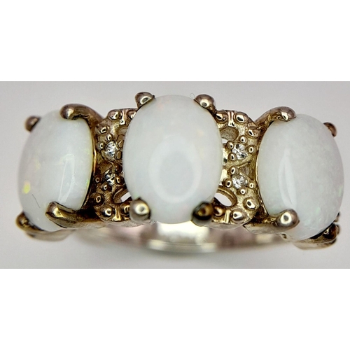 1778 - A Sterling Silver Filigree Design Opal Set Ring Size N. Set with three 8mm Long Opal Cabochons with ... 