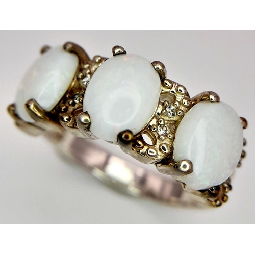 1778 - A Sterling Silver Filigree Design Opal Set Ring Size N. Set with three 8mm Long Opal Cabochons with ... 