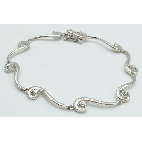 1992 - A 925 Silver Wave Design Cubic Zirconia Tennis Bracelet. 19cm Length. 6mm Width at Widest Point. Gro... 