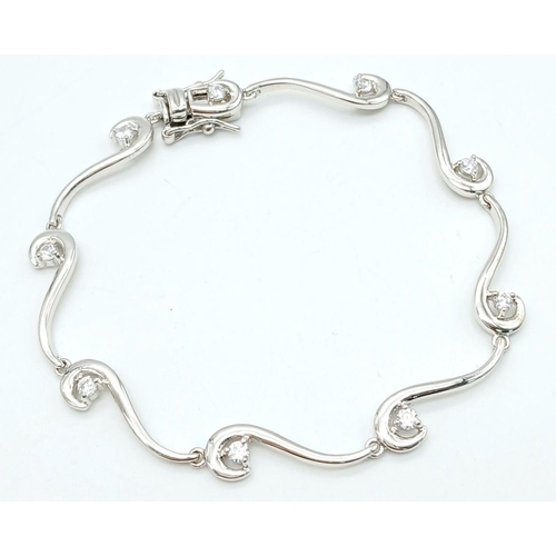 1992 - A 925 Silver Wave Design Cubic Zirconia Tennis Bracelet. 19cm Length. 6mm Width at Widest Point. Gro... 