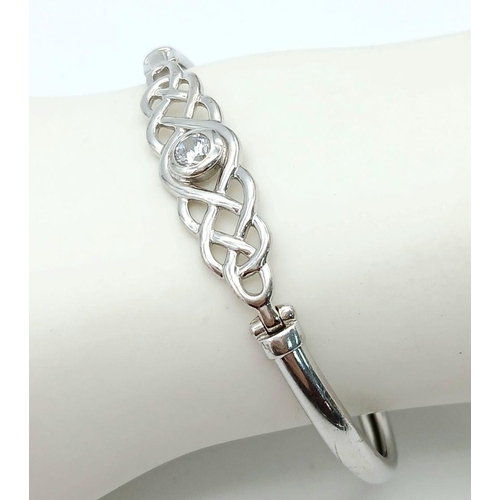 1561 - A Vintage Sterling Silver, Stone Set, Celtic Knot Design Bangle. 6cm Inner Width. Gross Weight 8.05 ... 