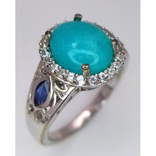 1568 - A Sterling Silver Turquoise Cabochon, Sapphire and White Topaz Set Ring Size S. The Ring is set with... 