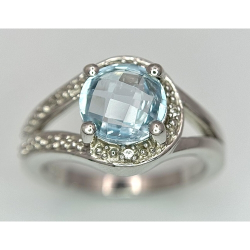 1603 - A Sterling Silver Aquamarine and Diamond Set Ring Size N. Set with an 8mm Round Cut Faceted Aquamari... 