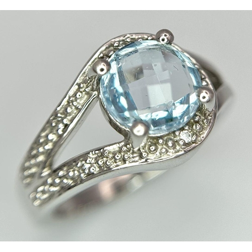 1603 - A Sterling Silver Aquamarine and Diamond Set Ring Size N. Set with an 8mm Round Cut Faceted Aquamari... 