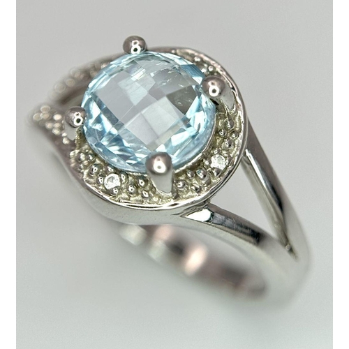 1603 - A Sterling Silver Aquamarine and Diamond Set Ring Size N. Set with an 8mm Round Cut Faceted Aquamari... 