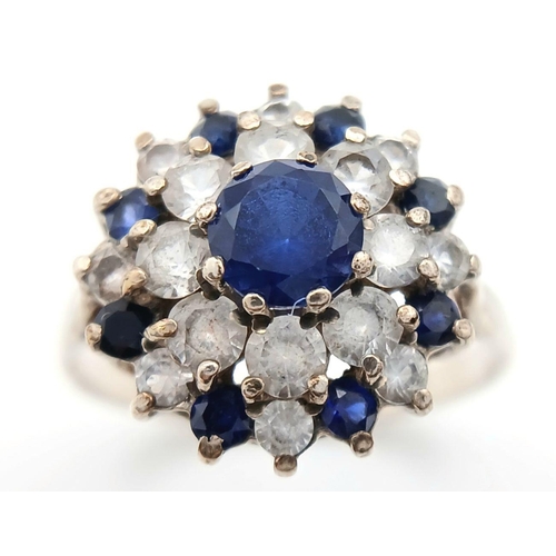 1470 - A Vintage Hallmarked 1986 Silver Sapphire and CZ Cluster Ring Size N. The Crown Measures 1.5cm Wide ... 