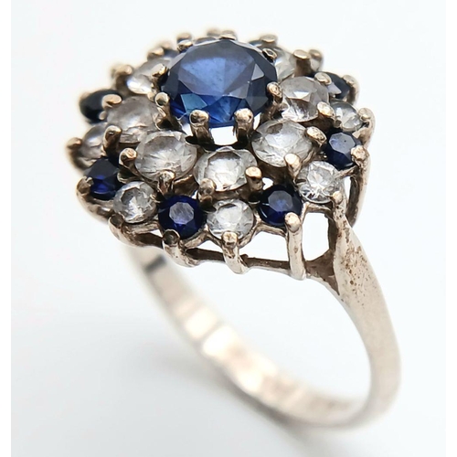 1470 - A Vintage Hallmarked 1986 Silver Sapphire and CZ Cluster Ring Size N. The Crown Measures 1.5cm Wide ... 