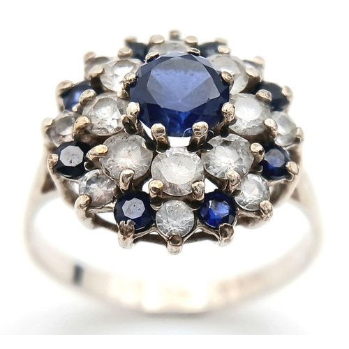 1470 - A Vintage Hallmarked 1986 Silver Sapphire and CZ Cluster Ring Size N. The Crown Measures 1.5cm Wide ... 