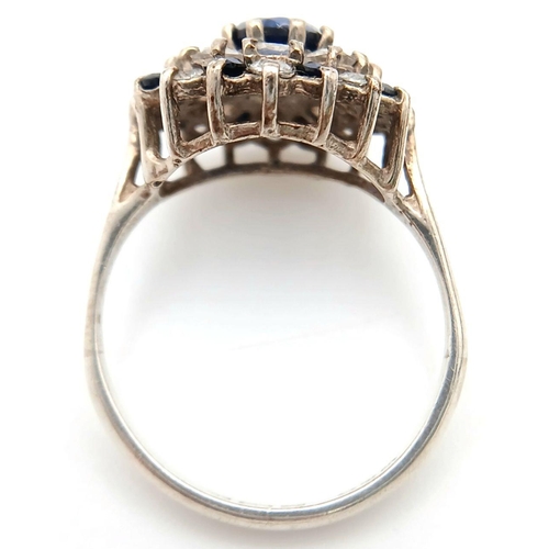 1470 - A Vintage Hallmarked 1986 Silver Sapphire and CZ Cluster Ring Size N. The Crown Measures 1.5cm Wide ... 