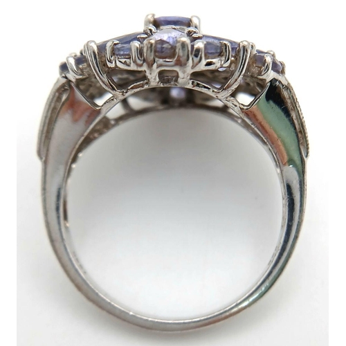 1942 - A Sterling Silver Art Deco Design Tanzanite Set Ring Size S. The Ring measures 2.2cm Wide at the Cro... 