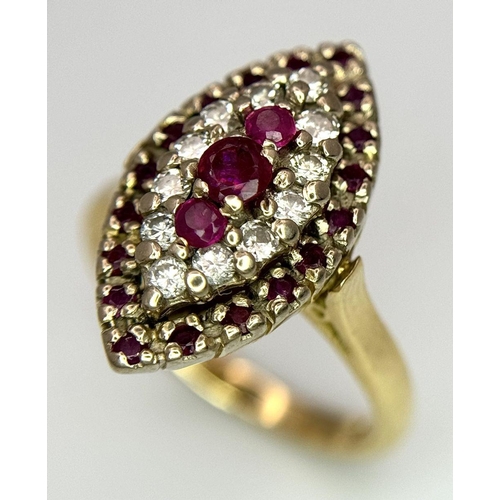 1579 - An 18K Yellow Gold Ruby and Diamond Ring. Marquise shape with ruby and diamond clusters. Size K 1/2.... 