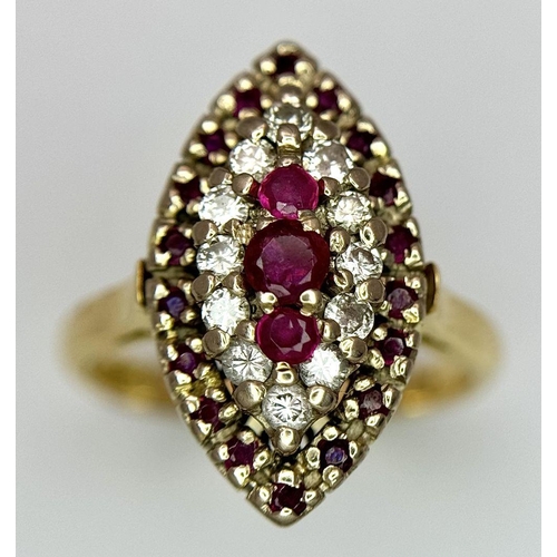 1579 - An 18K Yellow Gold Ruby and Diamond Ring. Marquise shape with ruby and diamond clusters. Size K 1/2.... 