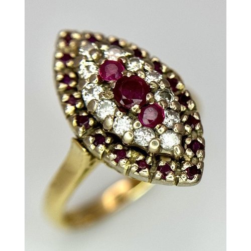 1579 - An 18K Yellow Gold Ruby and Diamond Ring. Marquise shape with ruby and diamond clusters. Size K 1/2.... 