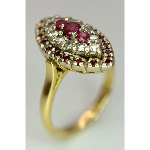 1579 - An 18K Yellow Gold Ruby and Diamond Ring. Marquise shape with ruby and diamond clusters. Size K 1/2.... 