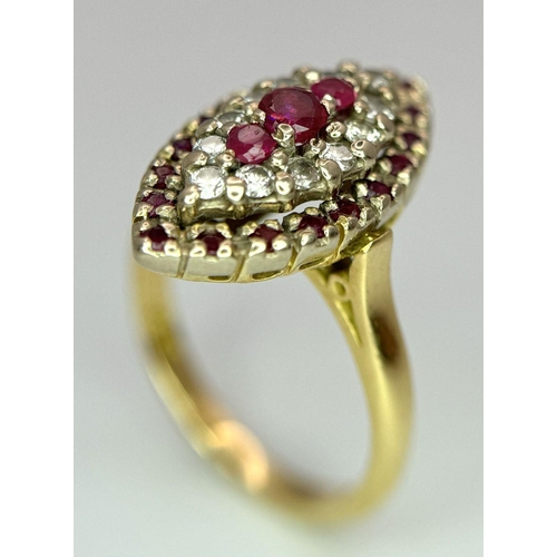 1579 - An 18K Yellow Gold Ruby and Diamond Ring. Marquise shape with ruby and diamond clusters. Size K 1/2.... 