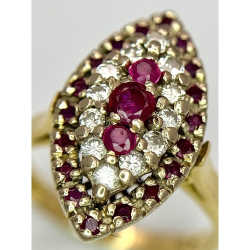 1579 - An 18K Yellow Gold Ruby and Diamond Ring. Marquise shape with ruby and diamond clusters. Size K 1/2.... 