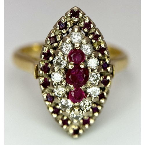 1579 - An 18K Yellow Gold Ruby and Diamond Ring. Marquise shape with ruby and diamond clusters. Size K 1/2.... 