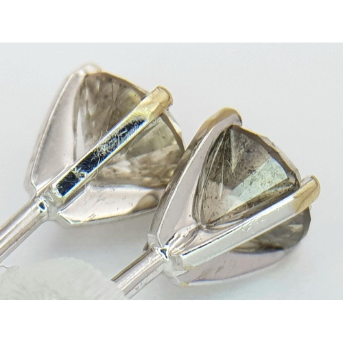 1593 - A Pair of 18K Gold Fancy Brown Diamond Stud Earrings. 1.3ctw. 1.16g total weight. nl12358