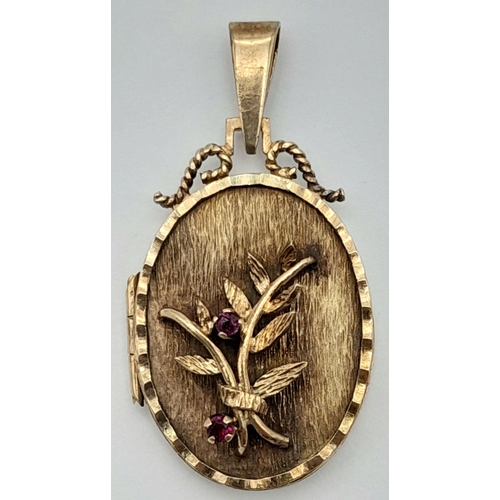 1623 - A 9K YELLOW GOLD 3D FLORAL LOCKET PENDANT SET WITH TWO RUBIES 3CM X 2CM 6.8G. REF: SH1791I