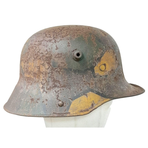 698 - A WW1 Imperial German M17 Jigsaw pattern camouflage Stahlhelm with liner.