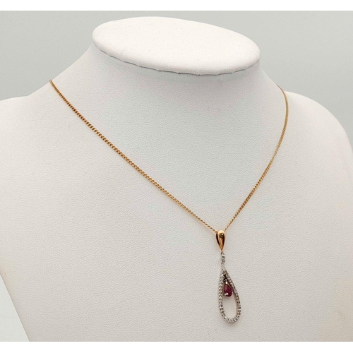 167 - A 9K YELLOW GOLD DIAMOND & RUBY SET PENDANT ON CHAIN.  3.2G. 3CM AND 46CM.