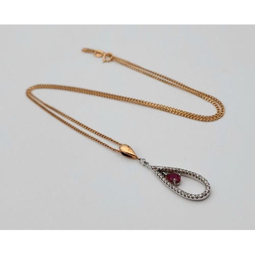 167 - A 9K YELLOW GOLD DIAMOND & RUBY SET PENDANT ON CHAIN.  3.2G. 3CM AND 46CM.