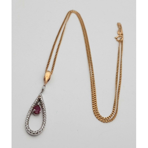 167 - A 9K YELLOW GOLD DIAMOND & RUBY SET PENDANT ON CHAIN.  3.2G. 3CM AND 46CM.