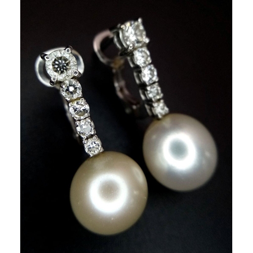 32 - A Pair of 18K White Gold, Diamond and Pearl Earrings. 0.80ctw diamonds. Lever-back clasp. 2cm. 5.05g... 