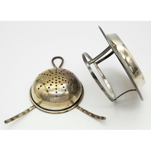 331 - An Antique Sterling Silver Tea Strainer and Base. Hallmarks for Birmingham 1924. 4.5cm tall. 55g