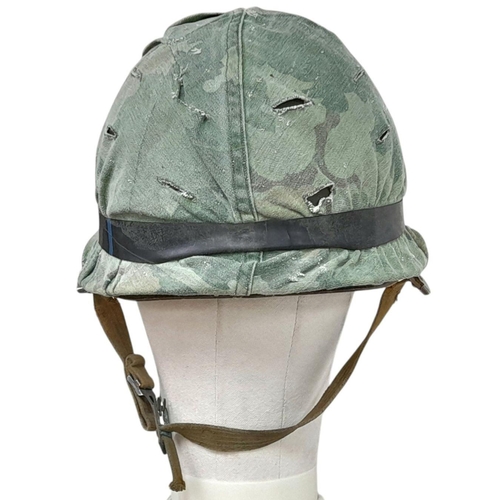 390 - A Vietnam War Era US M1 Helmet with liner, chin strap and reversible Mitch/Duck Hunter cover.