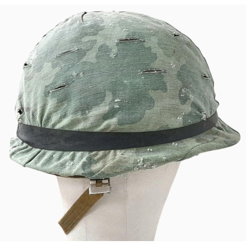 390 - A Vietnam War Era US M1 Helmet with liner, chin strap and reversible Mitch/Duck Hunter cover.