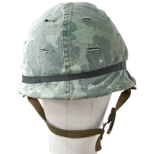 390 - A Vietnam War Era US M1 Helmet with liner, chin strap and reversible Mitch/Duck Hunter cover.