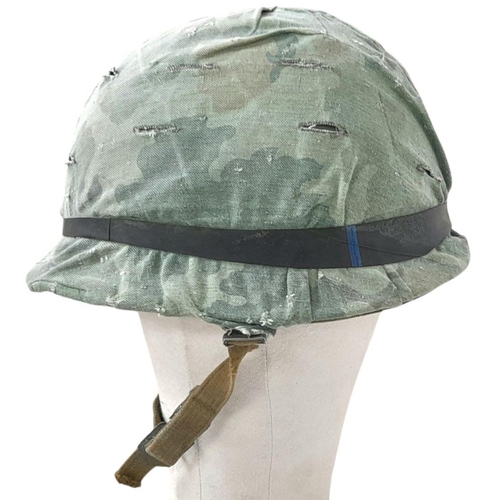 390 - A Vietnam War Era US M1 Helmet with liner, chin strap and reversible Mitch/Duck Hunter cover.