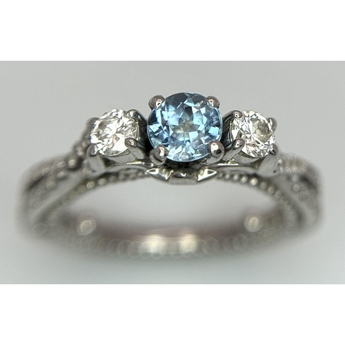 55 - AN 18K WHITE GOLD DIAMOND & TOPAZ 3 STONE RING. 5.8G. SIZE H 1/2.