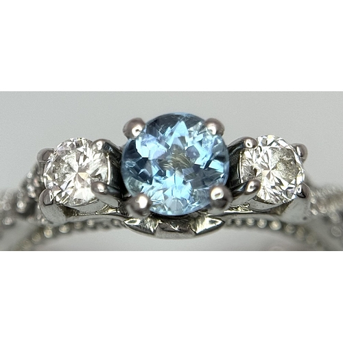 55 - AN 18K WHITE GOLD DIAMOND & TOPAZ 3 STONE RING. 5.8G. SIZE H 1/2.