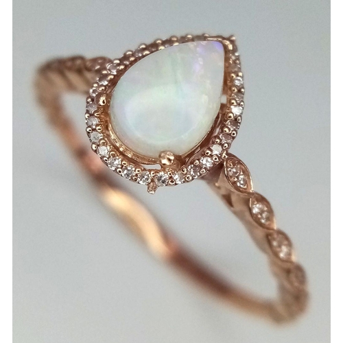 566 - A 9K ROSE GOLD DIAMOND & OPAL SET RING 1.7G TOTAL WEIGHT, SIZE R. Ref: SC 7029