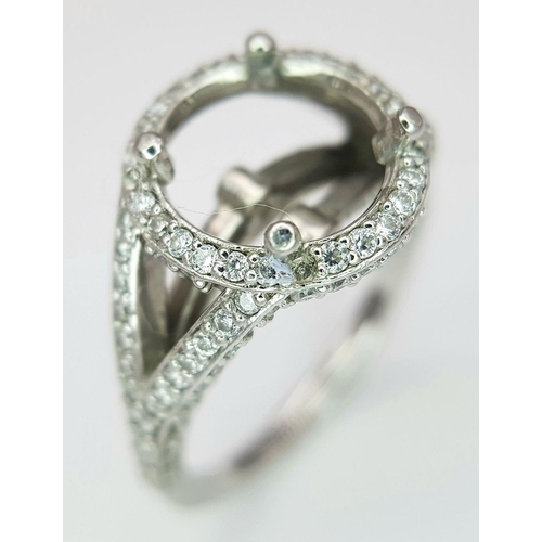 62 - A PLATINUM DIAMOND SET RING MOUNT - WILL HOLD A 2.75CT - 3CT ROUND STONE. 6.1G. SIZE J.