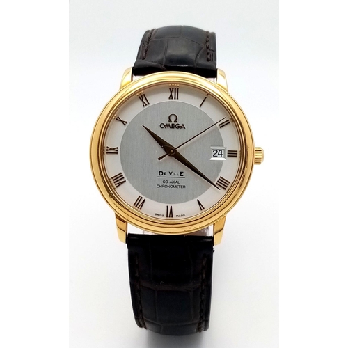 92 - An Omega Deville Prestige 18K Gold Cased Watch. Black leather strap with original gold buckle. 18k g... 