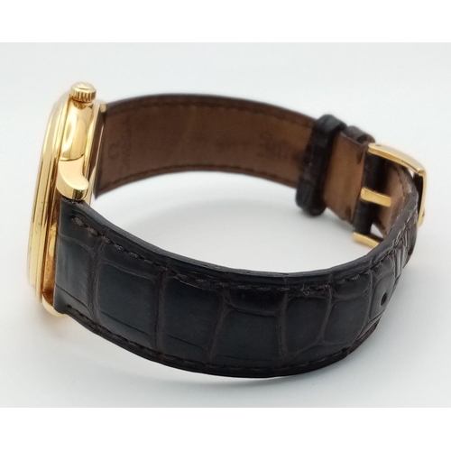 92 - An Omega Deville Prestige 18K Gold Cased Watch. Black leather strap with original gold buckle. 18k g... 