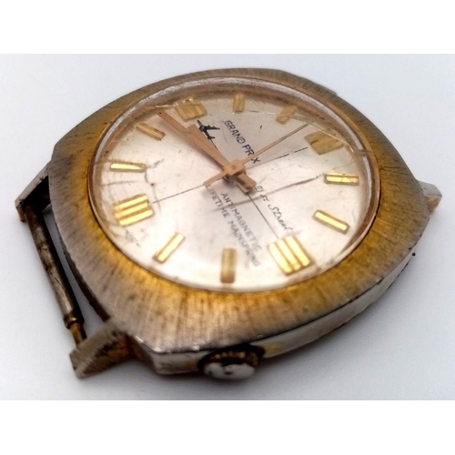 2285 - A Vintage Grand Prix 21st Street Watch Stainless Steel Case and Movement. 38mm width. Silver tone di... 