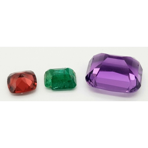 1996 - A Trio of Gemstones. A 0.92ct Pakistani Emerald - octagon shape, step cut. A 1.09ct Tanzanian Malaya... 