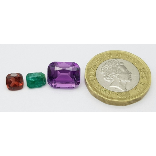 1996 - A Trio of Gemstones. A 0.92ct Pakistani Emerald - octagon shape, step cut. A 1.09ct Tanzanian Malaya... 