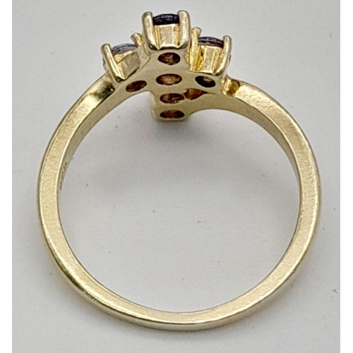 1961 - A Yellow Gold Gilt Sterling Silver Tanzanite Set Cross Ring Size M1/2. The Cross Measures 1.2cm Leng... 