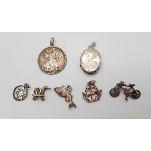 1715 - An assorted collection of 7 sterling silver pendants/charms. Total weight 15G. Please see photos for... 